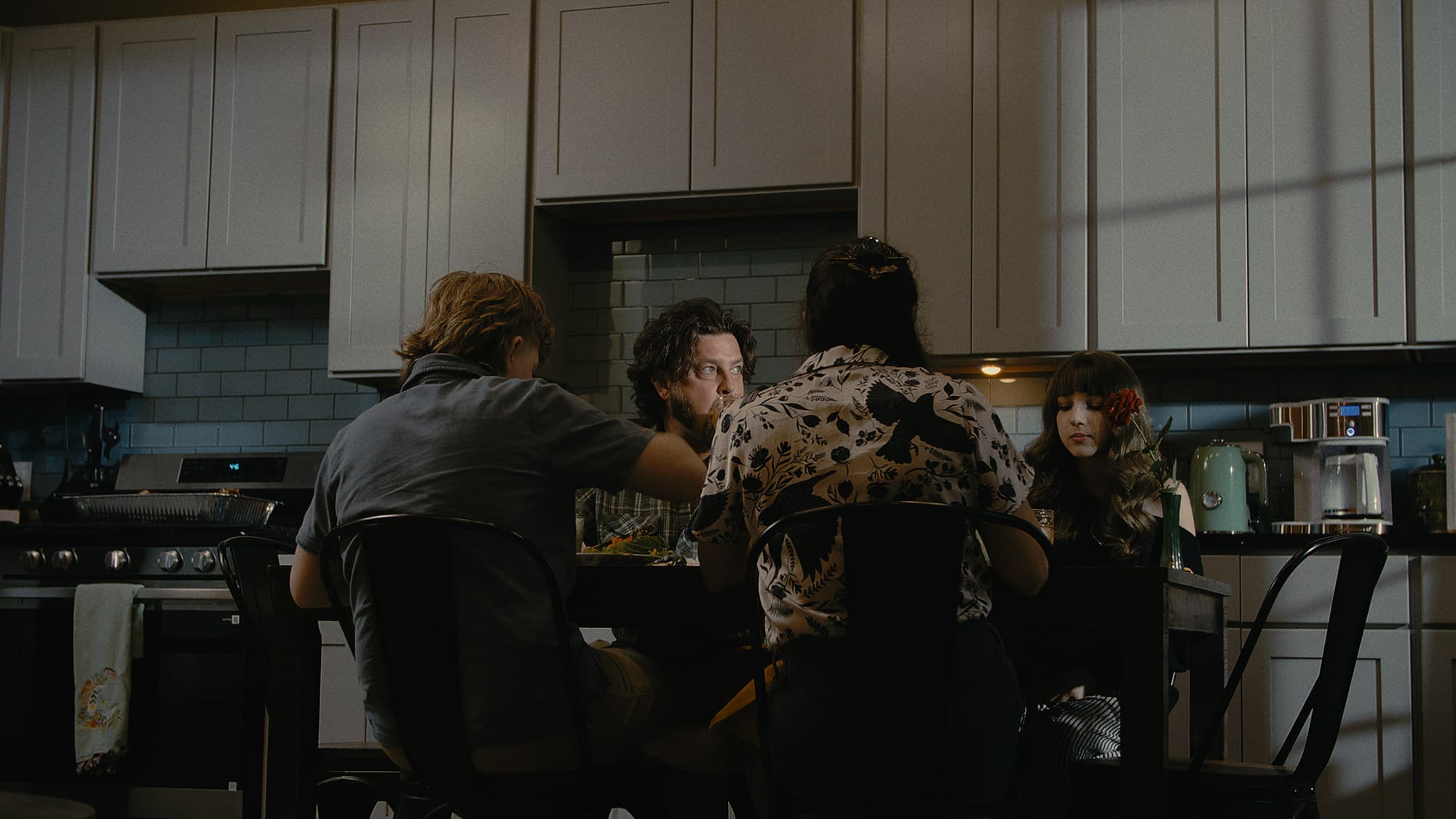 A family gathered around a kitchen table
